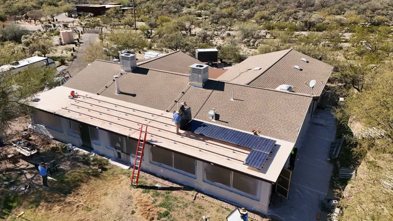 Drone view of solar panel reinstallation on a Tucson tile roof by Blueprint Home Services